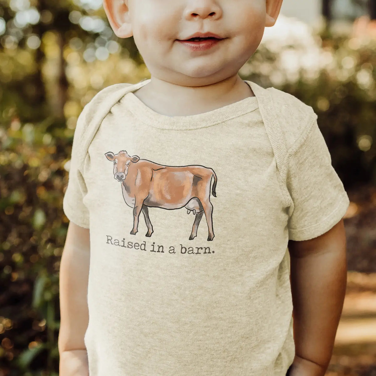 "Raised in A Barn" Cow Onesie